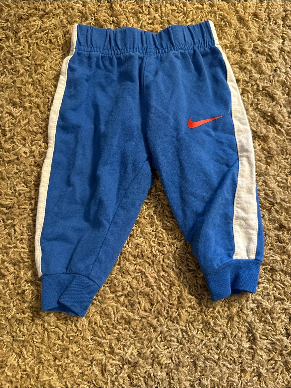 Nike Royal Blue Kids Joggers with White Side Panels and Red Swoosh